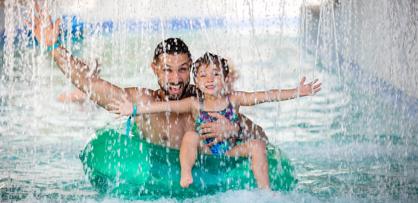 father and daughter in the lazy river at Centara Mirage Beach Resort Dubai CDD