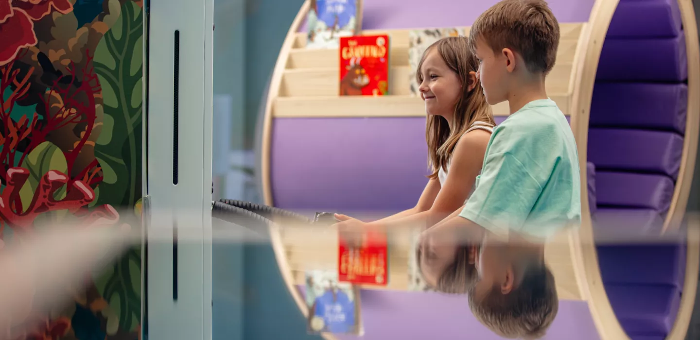 Kids playing interactive games in Centara Mirage Beach Resort Dubai