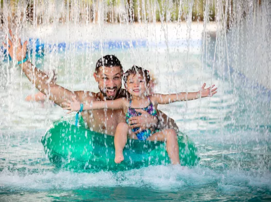 Father and daughter in the lazy river Centara Mirage Beach Resort Dubai