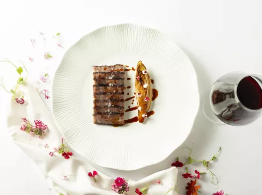 gourmet steak at one of the top-rated rooftop restaurants in bangkok
